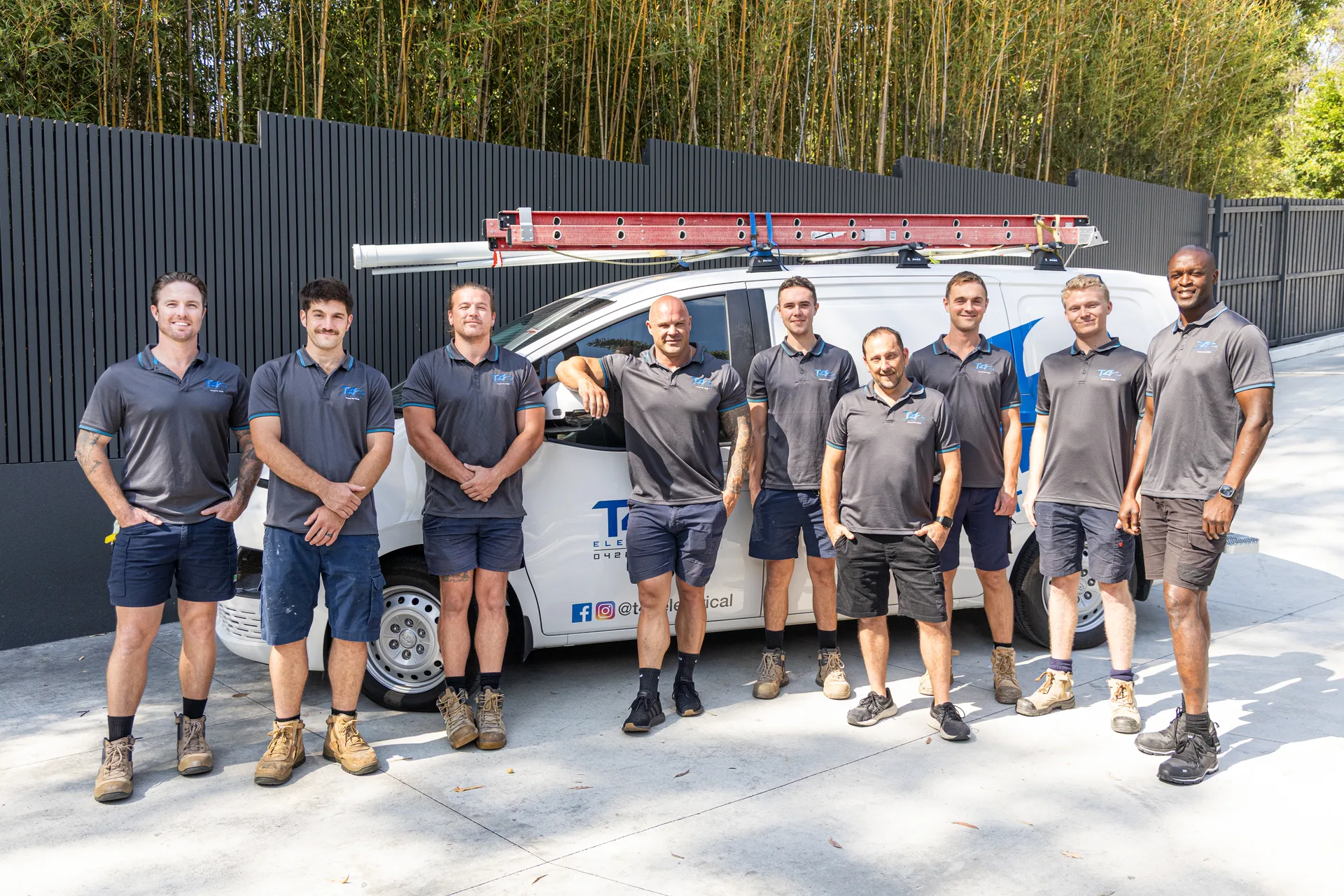 The Family Electrician Merrimac team with a service van